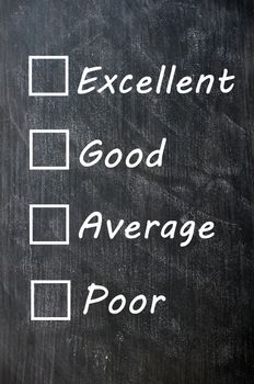 customer survey or poll (excellent, good, average, poor) with check boxes sketched with white chalk on a blackboard with eraser smudges 