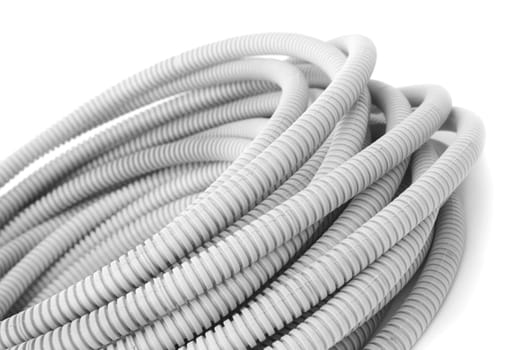 Corrugated pipe for the cable on a white background