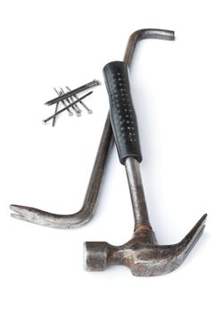 The old hammer and nail puller on white