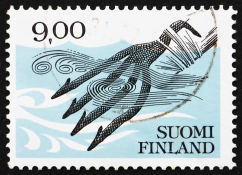 FINLAND - CIRCA 1984: a stamp printed in the Finland shows Iron Fish Spear c.1100, circa 1984