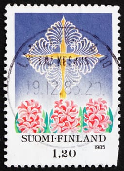 FINLAND - CIRCA 1985: a stamp printed in the Finland shows Cross of St. Thomas and Hyacinths, Christmas, circa 1985