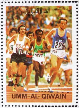 UMM AL-QUWAIN - CIRCA 1972: a stamp printed in the Umm al-Quwain shows Sprint, Running, Athletics, Summer Olympics, Munich 1972, circa 1972