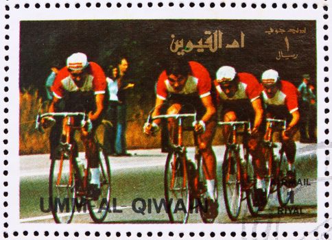 UMM AL-QUWAIN - CIRCA 1972: a stamp printed in the Umm al-Quwain shows Cycling, Summer Olympics, Munich 1972, circa 1972