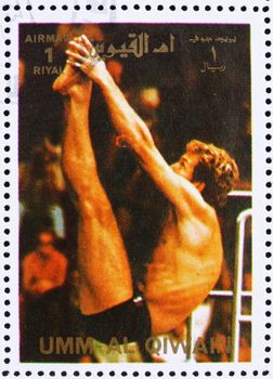 UMM AL-QUWAIN - CIRCA 1972: a stamp printed in the Umm al-Quwain shows Diving, Summer Olympics, Munich 1972, circa 1972