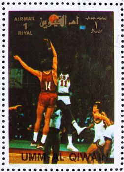 UMM AL-QUWAIN - CIRCA 1972: a stamp printed in the Umm al-Quwain shows Basketball, Summer Olympics, Munich 1972, circa 1972