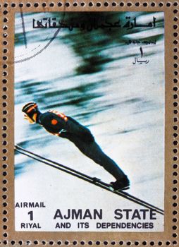 AJMAN - CIRCA 1973: a stamp printed in the Ajman shows Ski Jumping, Winter Olympics, circa 1973