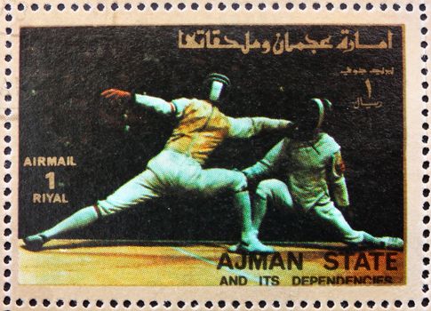 AJMAN - CIRCA 1973: a stamp printed in the Ajman shows Fencing, Olympic sports, circa 1973