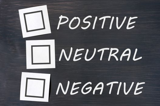 Feedback positive neutral negative on a chalkboard with blank checkboxes