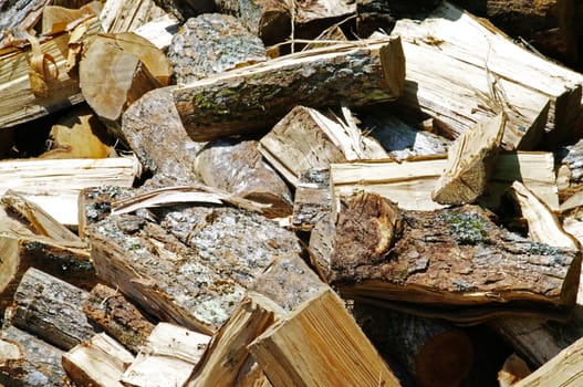 A pile of split wood ready for the fall