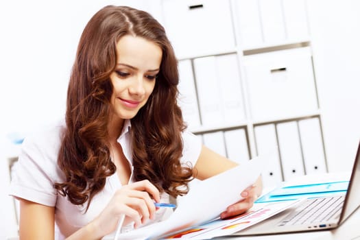 Business woman working on computer in office