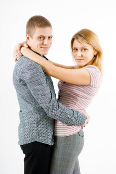 boy and girl hugging standing on a white background