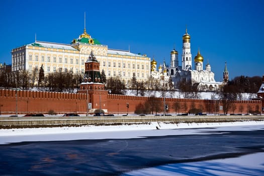 The red brick walls of famous Kremlin in Moscow with its churches