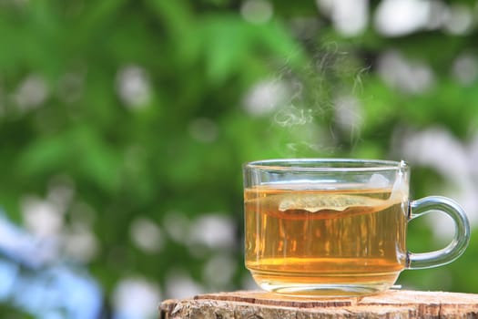 A glass bowl with hot Chinese tea