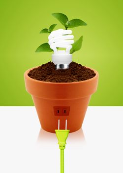 modern energy-saving concept, bright bulb in garden pot with small plant.