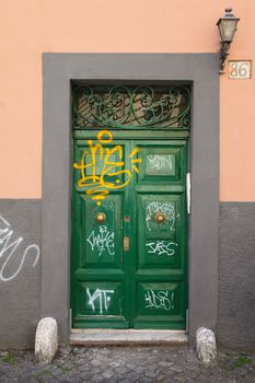 Graffiti art on doors in Rome street