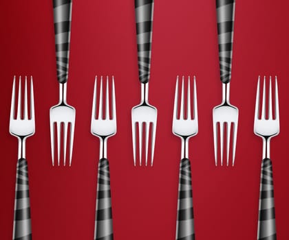 Set of forks on red background