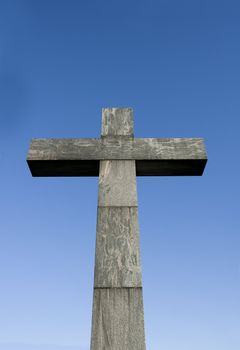 Cross symbol in front of blue sky