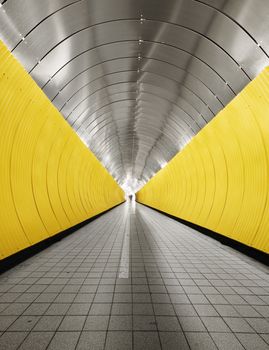 Yellow tunnel with people out of focus