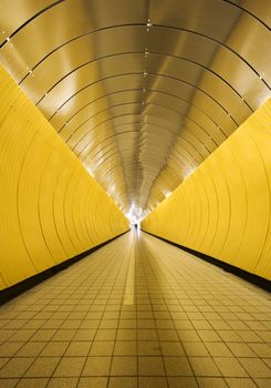 Yellow tunnel with people out of focus