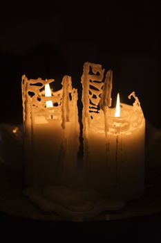 Burning candles on black background