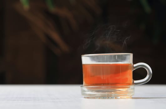 A glass bowl with hot Chinese tea