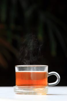 A glass bowl with hot Chinese tea