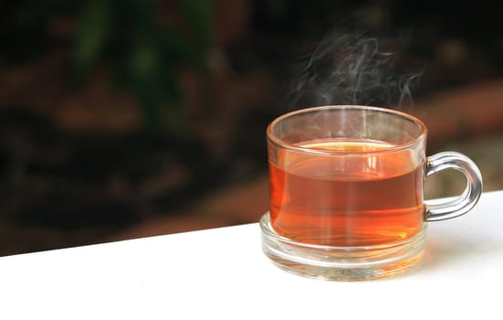 A glass bowl with hot Chinese tea