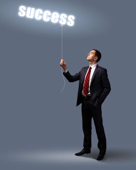 Light bulb and a business person as symbols of creativity in business