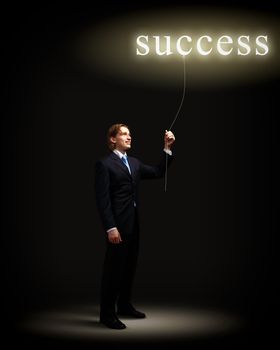 Light bulb and a business person as symbols of creativity in business