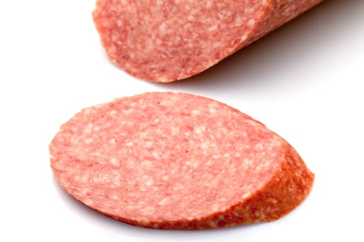 Piece of Salami on white background