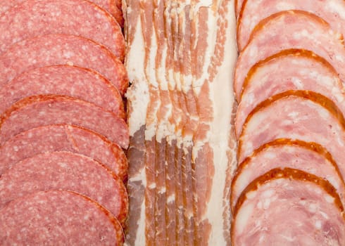 Background of Assorted Slice Sausage and Bacon, closeup