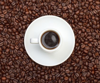 Cup with Hot Coffee on Background Coffee Beans