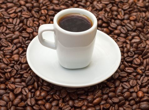 Cup with Hot Coffee on Background Coffee Beans