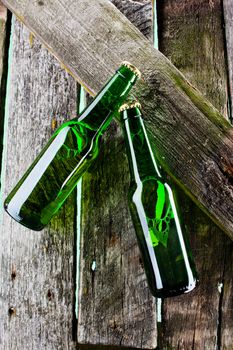 two beer bottle on old wooden plank backbround