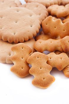 Round and shaped salted crackers in pile