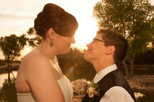 Smiling pair of white lesbian women in marriage ceremony