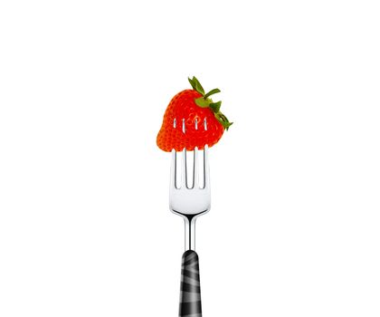 Strawberry pierced by fork, isolated on white background