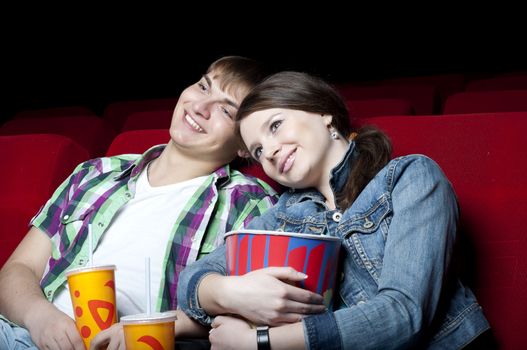 couple in a movie theater, watching a movie