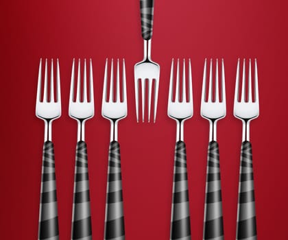 Set of forks on red background