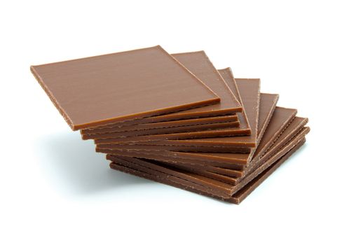 chocolate pieces on white background