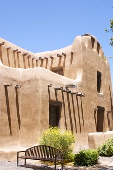 New Mexican Adobe Building, against a blue sky with copy space.