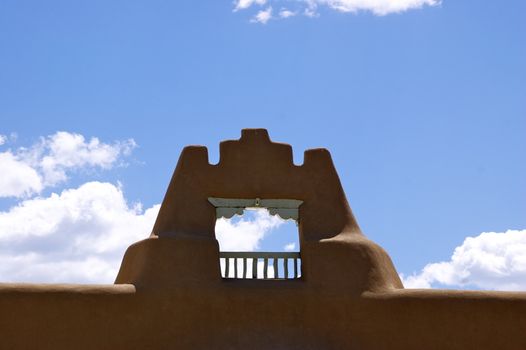 New Mexican Adobe archway against a deep blue sky with copy space.