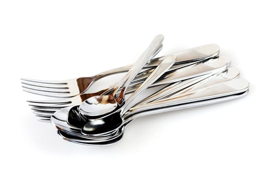 silvery forks and spoons on a white background