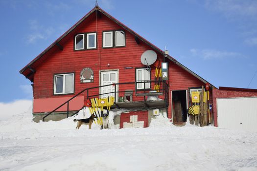 Red house at the mountain during winter season