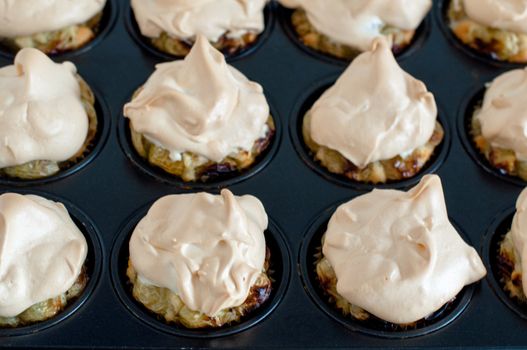 Gooseberry meringue cupcakes or muffins still in baking mould