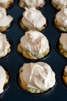 Gooseberry meringue cupcakes or muffins still in baking mould