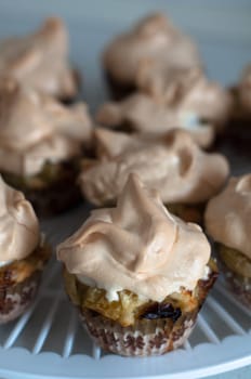 Gooseberry meringue cupcakes or muffins arranged on a plate