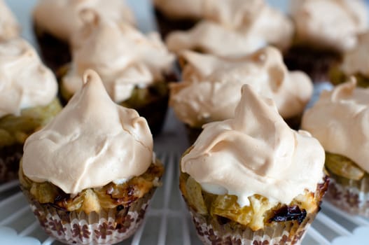 Gooseberry meringue cupcakes or muffins arranged on a plate