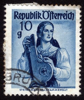 AUSTRIA - CIRCA 1948: A stamp printed in Austria shows image woman in national Austrian costumes,  Styria, Salzkammergut , series, circa 1948