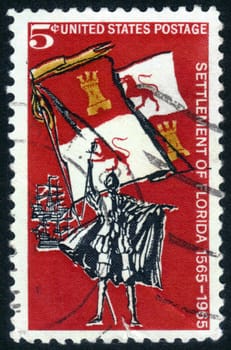 UNITED STATES OF AMERICA - CIRCA 1965: a stamp printed in the USA shows Spanish Explorer, Royal Flag and Ships, is dedicated to 400th anniversary of the first settlement in the USA St. Augustine, Florida, circa 1965